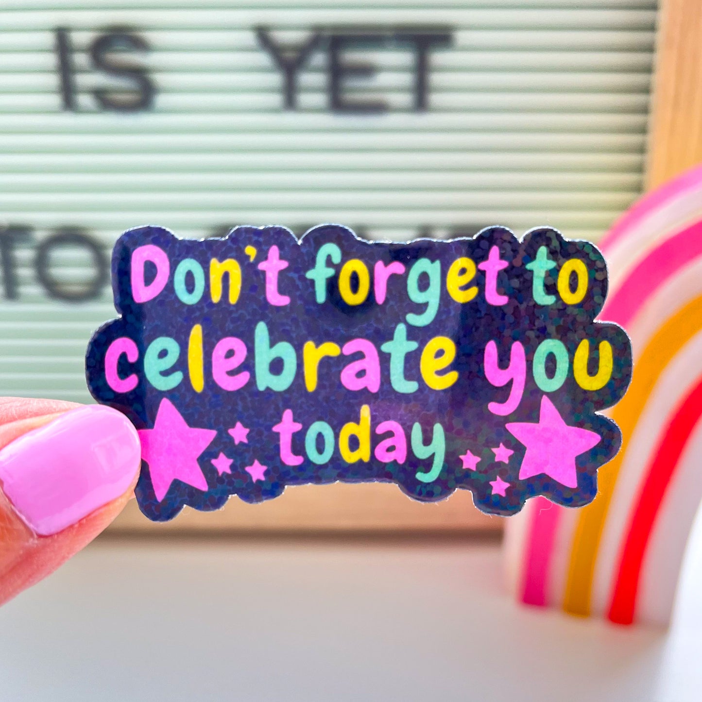 Celebrate you sticker in hand
