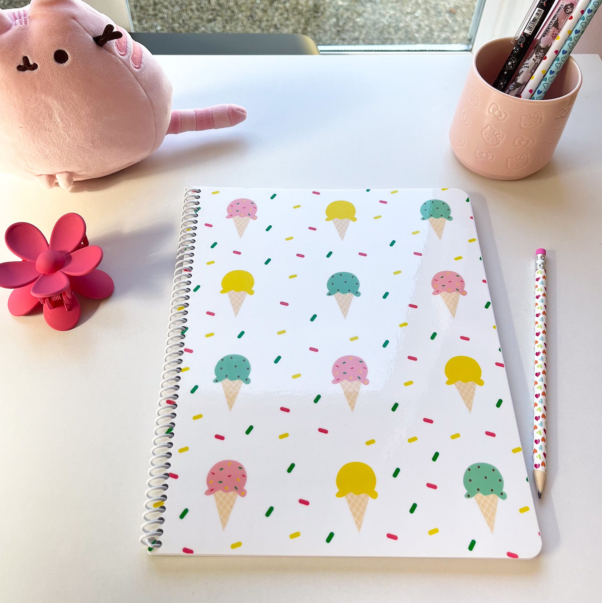 Ice Cream with Sprinkles Notebook features a yummy and adorable ice cream pattern with rainbow sprinkles in the background