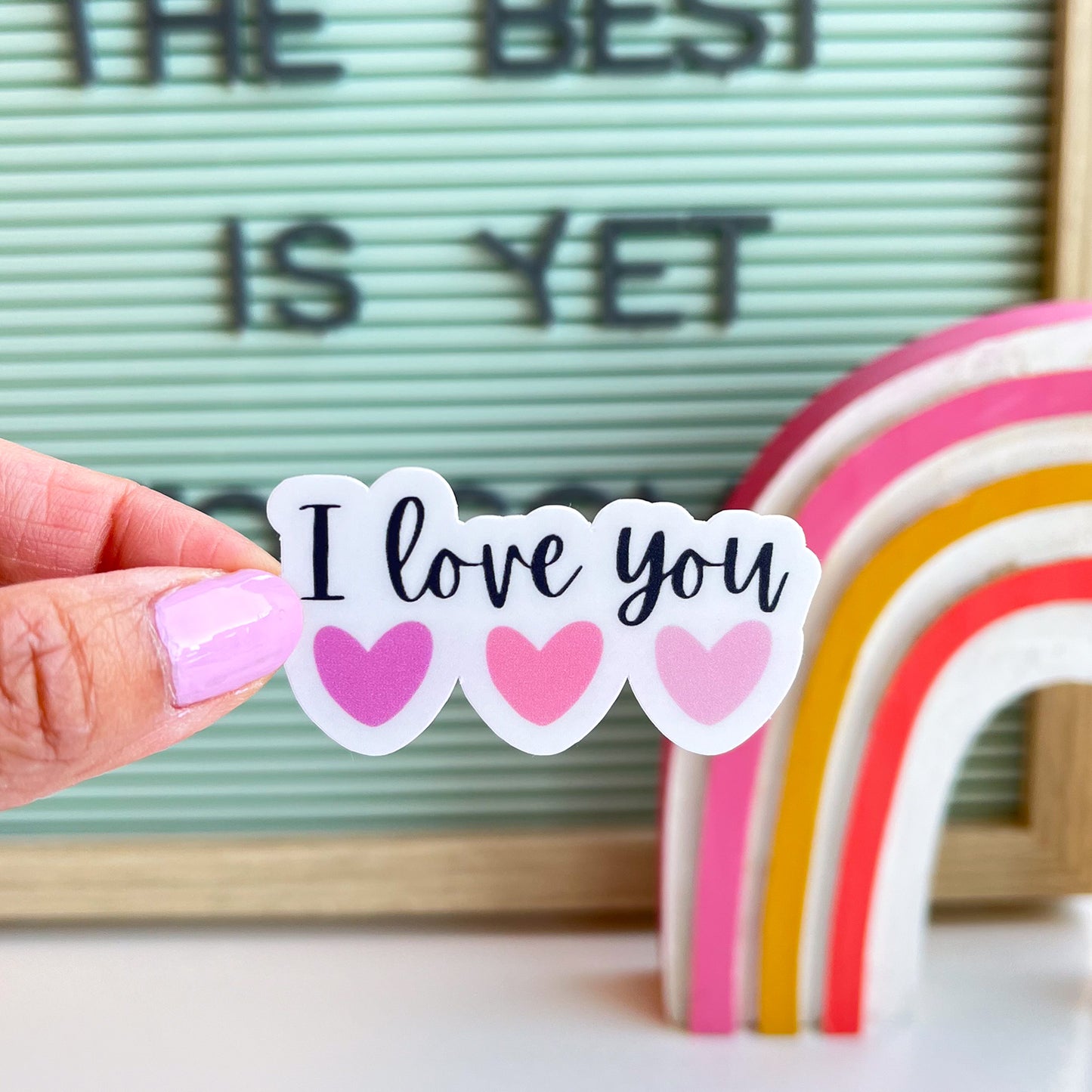 Simple modern I love you sticker in hand. Cute pink hearts aesthetic valentines sticker.