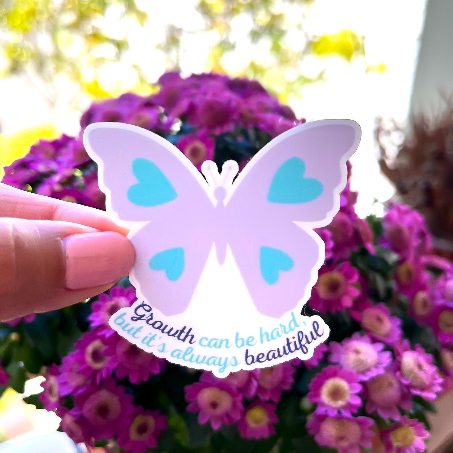 Butterfly sticker outside in hand
