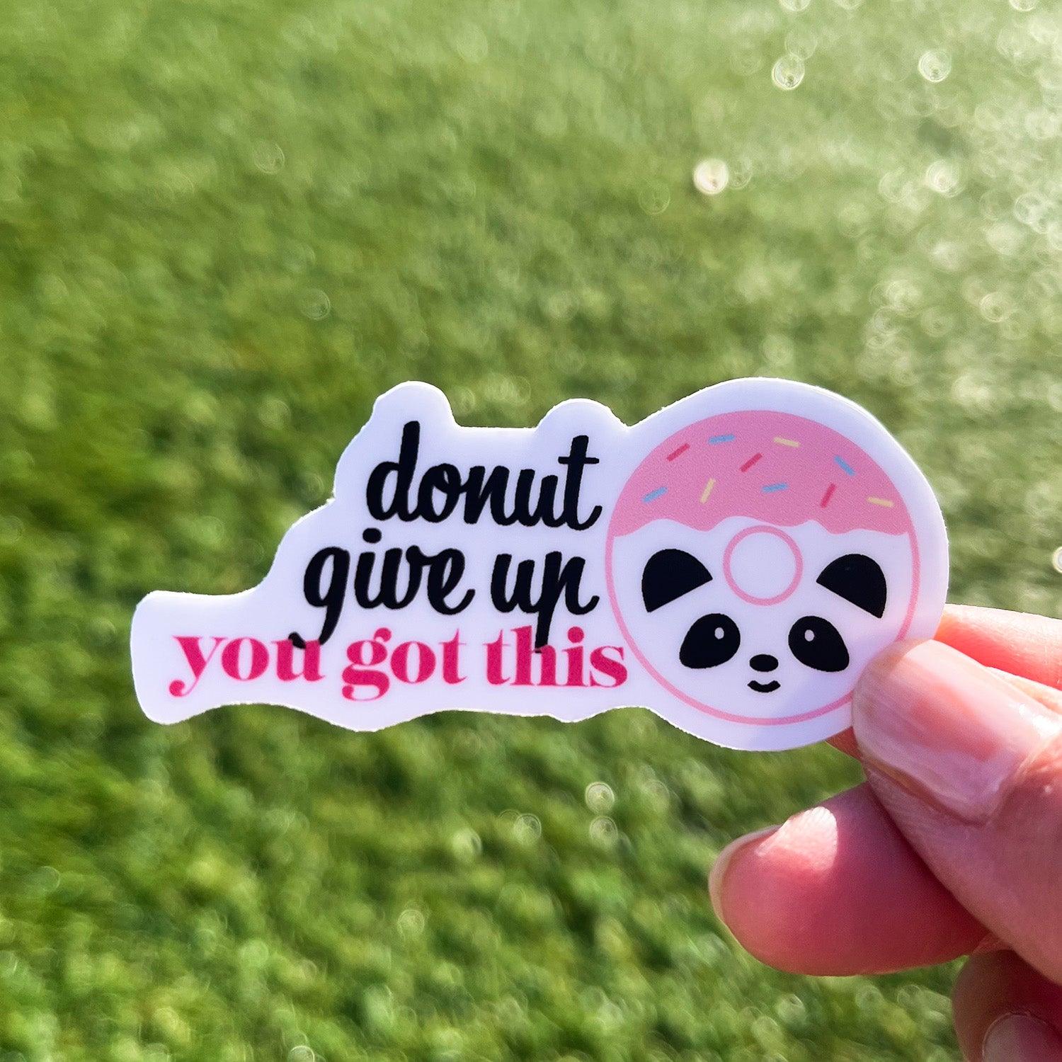 Donut give up sticker with grass and sunshine background