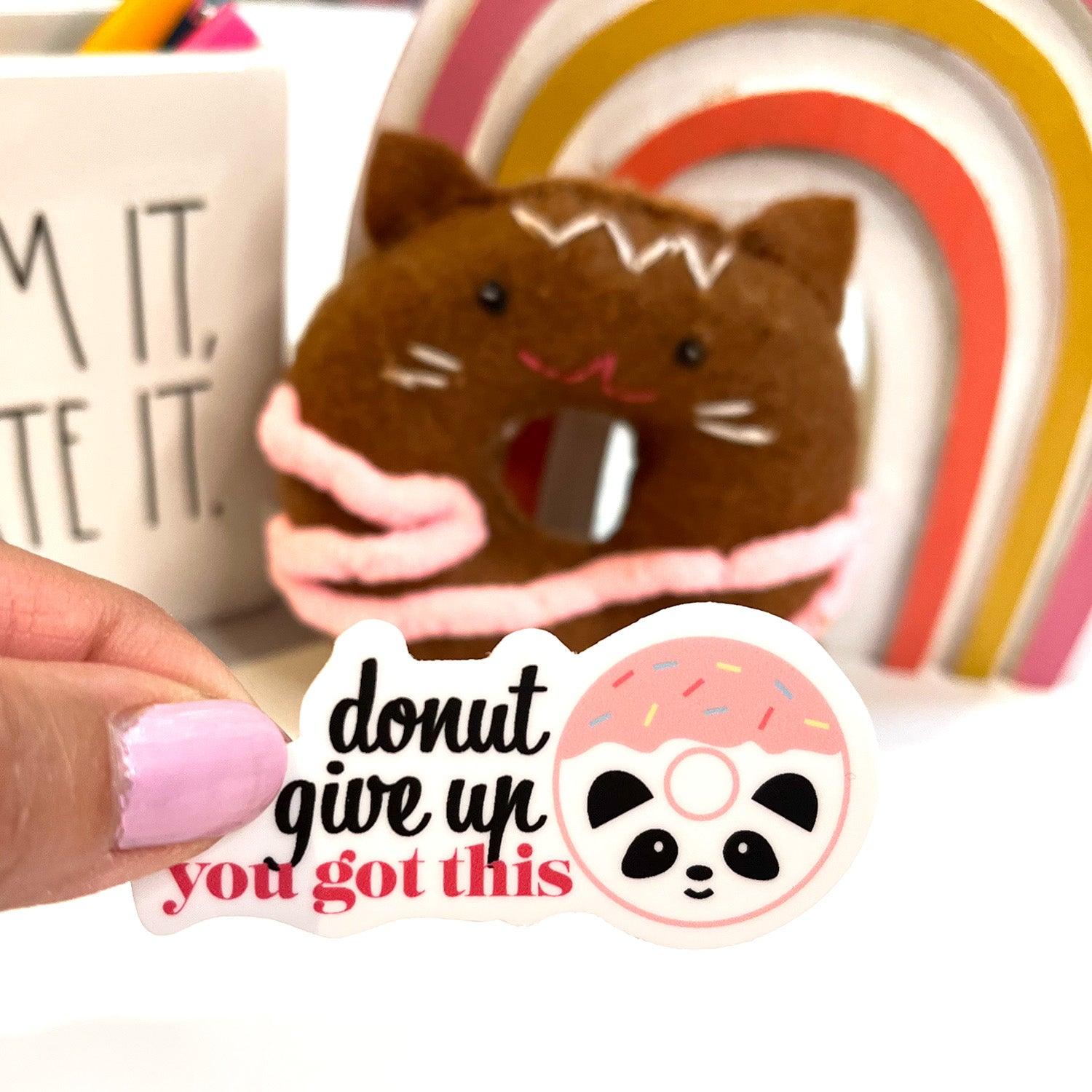 Donut give up sticker inside with rainbow background