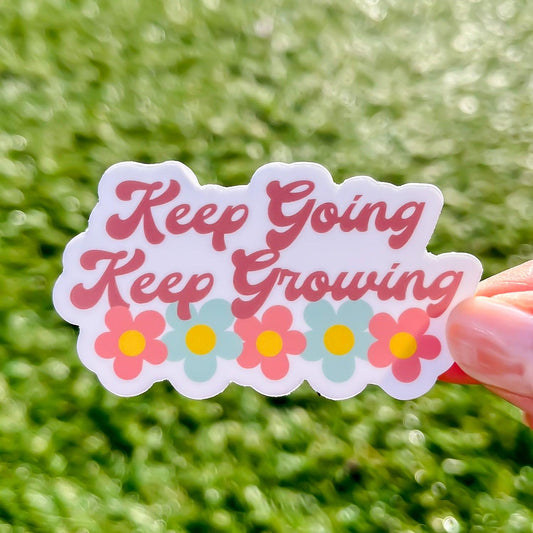 Keep Going Keep Growing sticker with grass and sunshine in the background