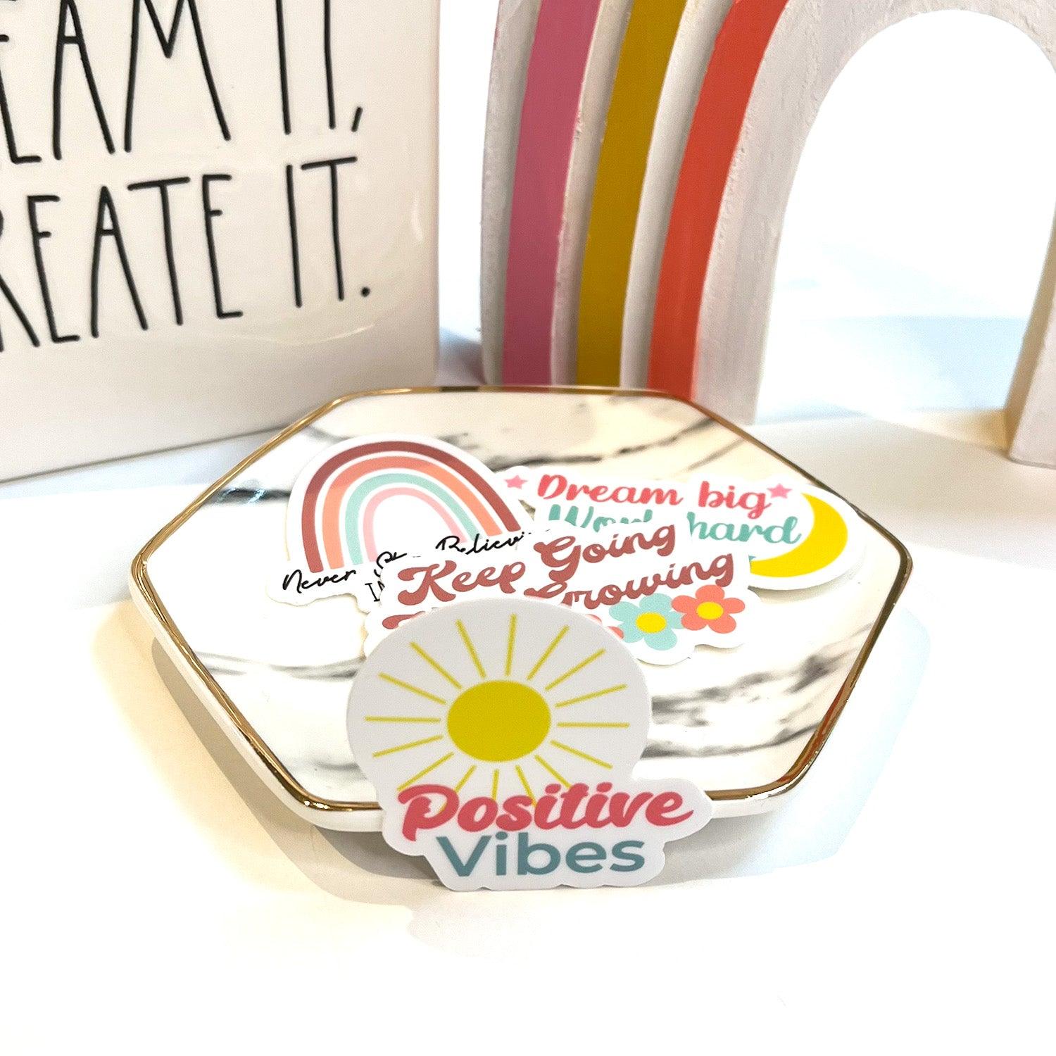 Positive Vibes sticker inside with rainbow background