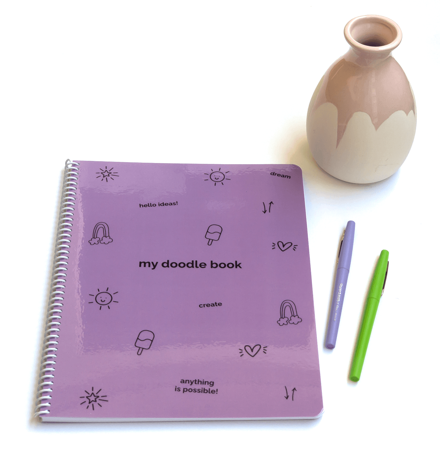 My Purple Doodle Book flat lay features a purple notebook with playful doodles and words to inspire creativity in your kids