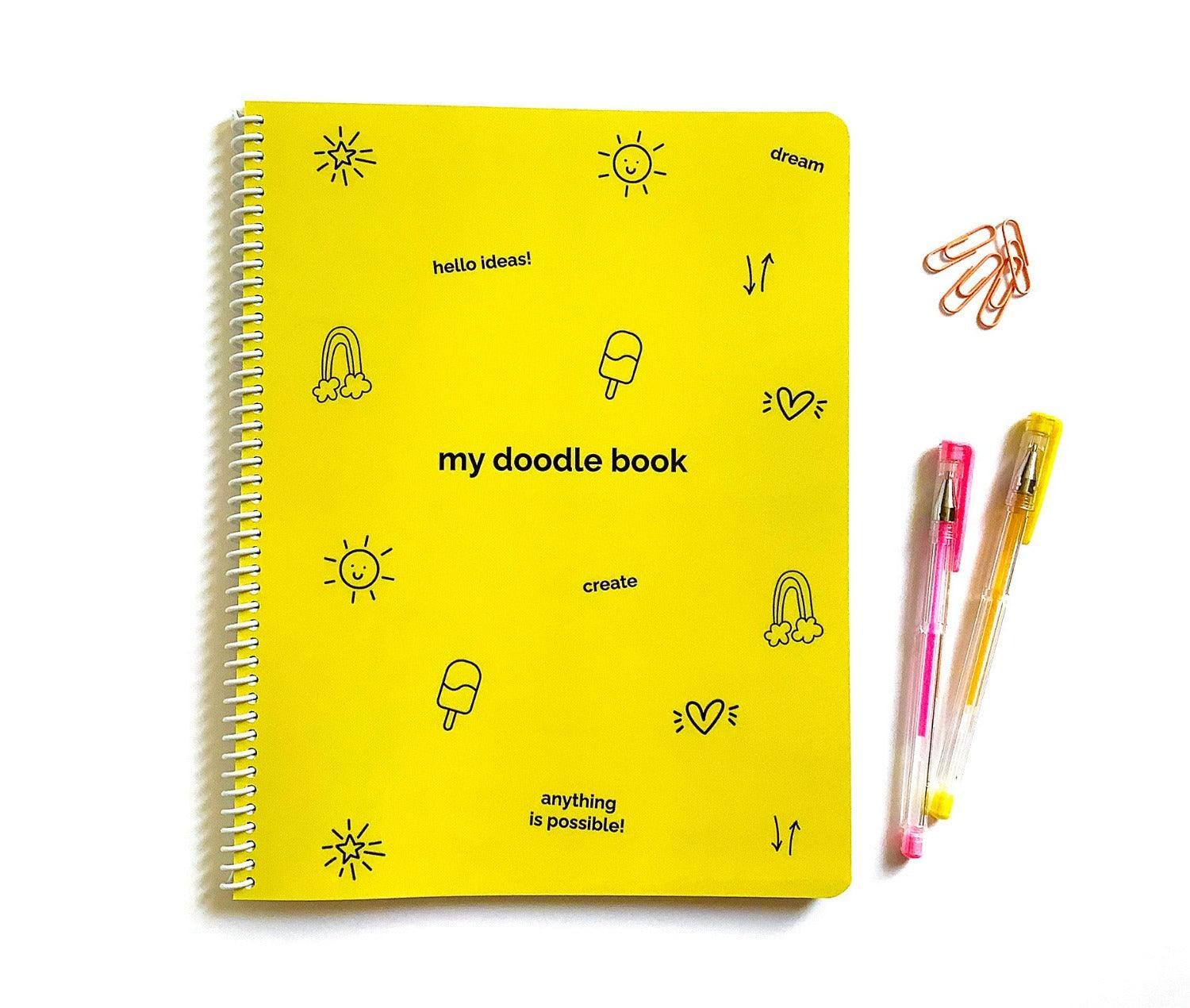 My Yellow Doodle Book flat lay features a bright yellow cover with playful doodles and words to inspire creativity in your kids